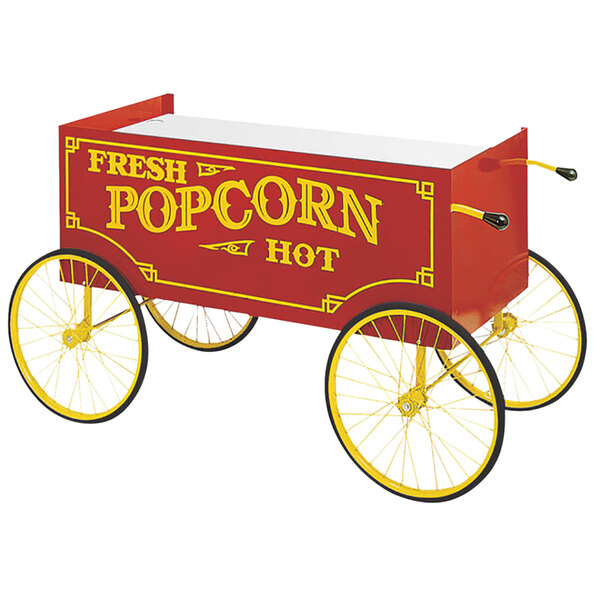 A Cretors red and yellow popcorn wagon with a wheel.