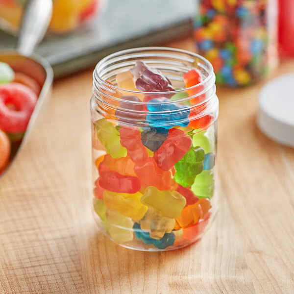 A clear round PET jar filled with gummy bears.