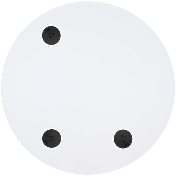 A white BFM Seating round tabletop with black circles and a black circle with a white border containing a lightning bolt.