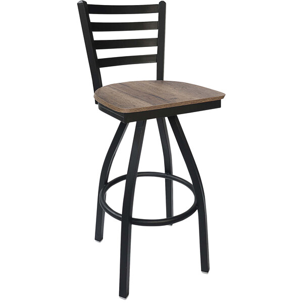 A BFM Seating black steel swivel barstool with a wooden seat.