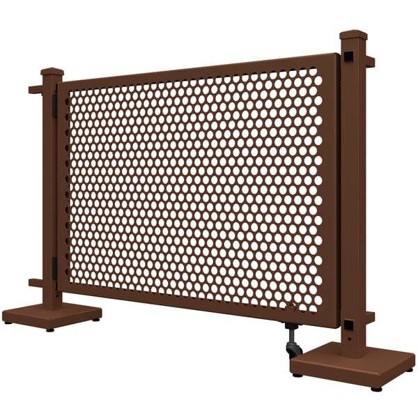 A brown metal SelectSpace gate with a circle pattern and stands.