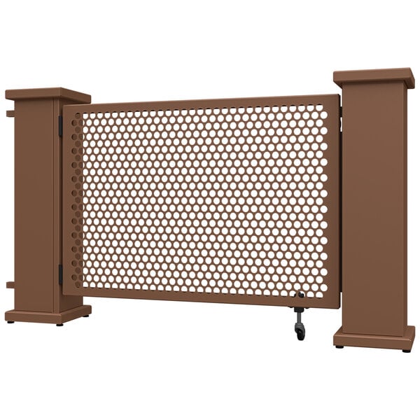 A brown metal fence with a circle pattern and brown metal planter stands.