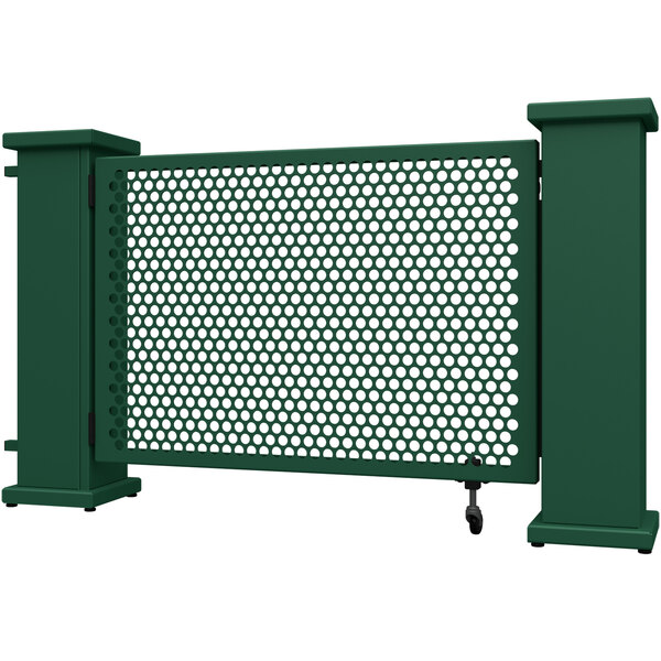 A forest green metal gate with circle and rectangular planter stands.