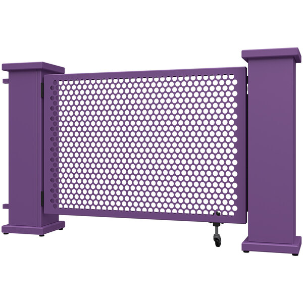A purple metal fence with holes in a circle pattern.