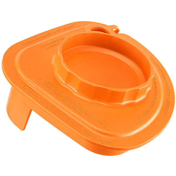 An orange plastic lid with a tethered plug for a Vitamix container.