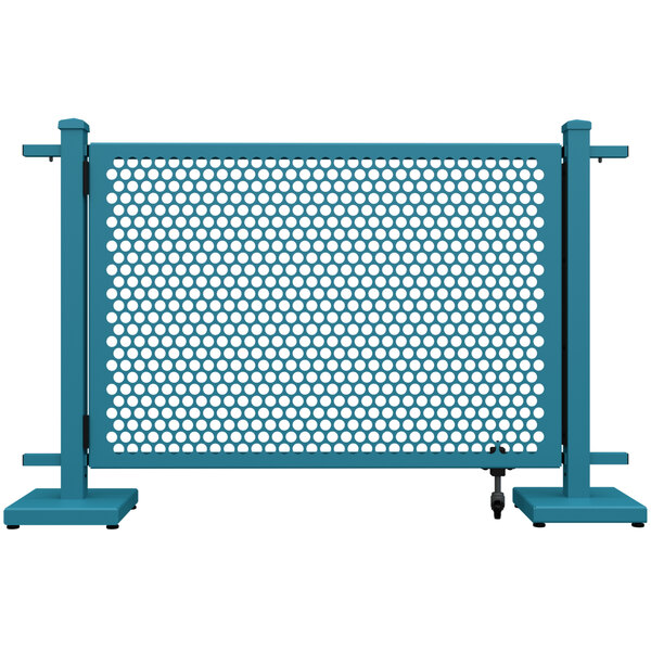 A teal metal gate with a white circle pattern.