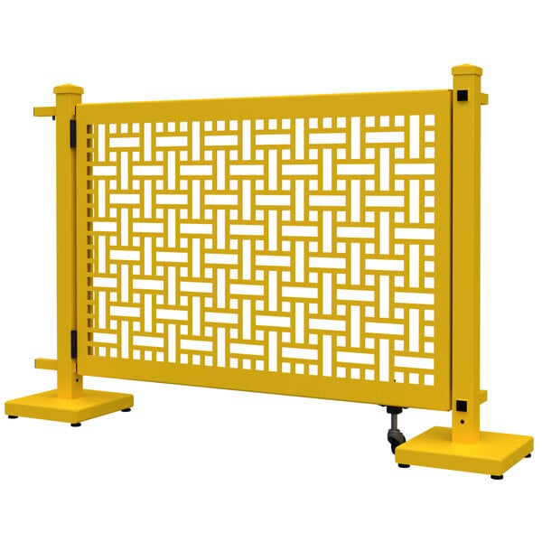 A bright yellow metal fence with a square weave pattern.