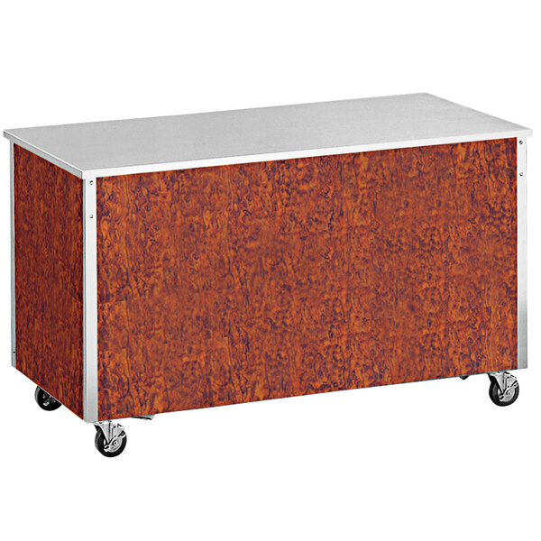 A brown rectangular Vollrath utility station with a stainless steel top on wheels.