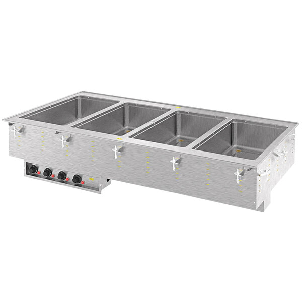 A Vollrath drop-in hot food well with four compartments in a stainless steel counter.