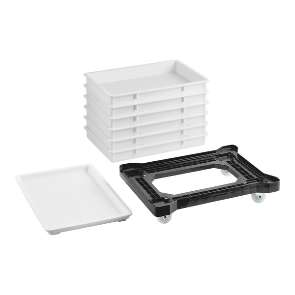 A set of six white dough proofing trays with a matching lid and a black plastic dolly with wheels.