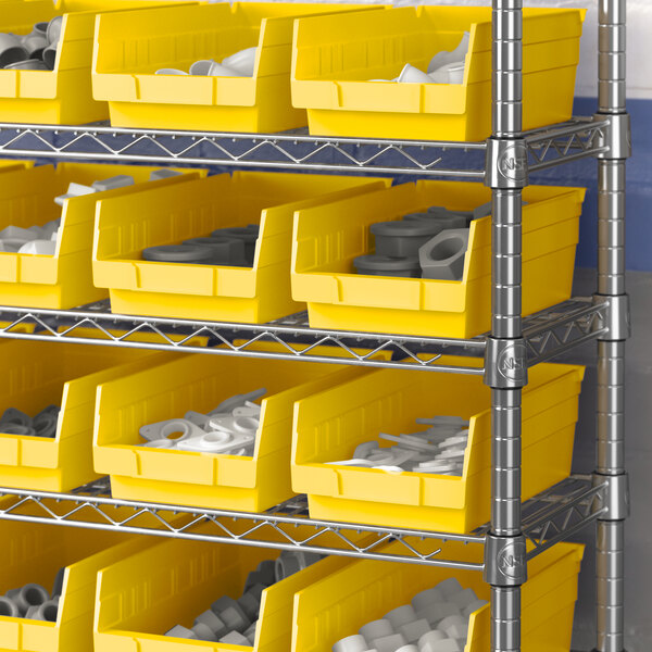A metal shelf with Regency yellow bins filled with white and grey objects.