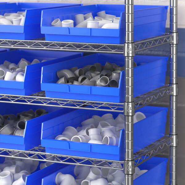 A metal shelf with blue Regency shelf bins.