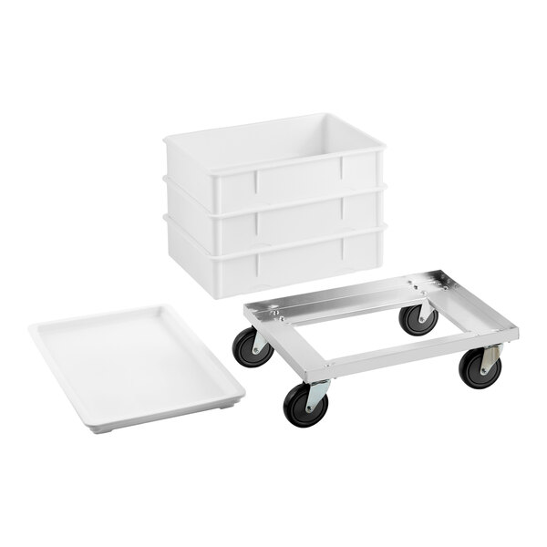 A white dough proofing set including three rectangular proofing boxes, a matching lid, and an aluminum dolly with four wheels.