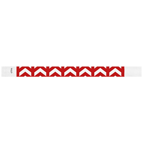 A white Carnival King wristband with red chevron patterns.