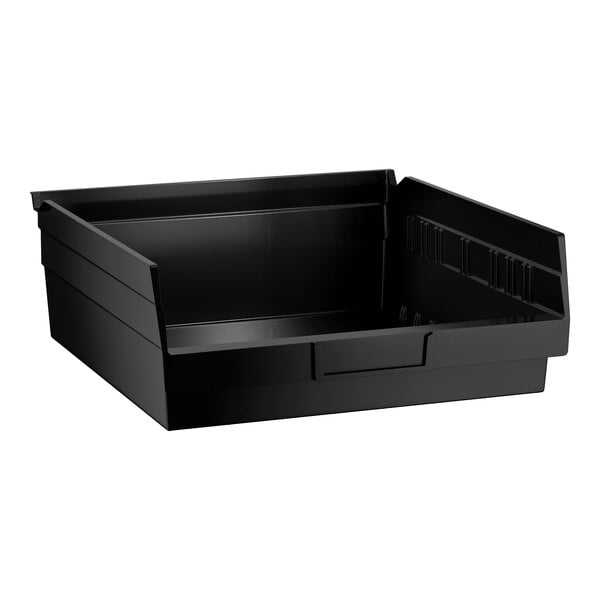 A black rectangular plastic bin with a low front and higher sides and back, designed for organizing or storing items.
