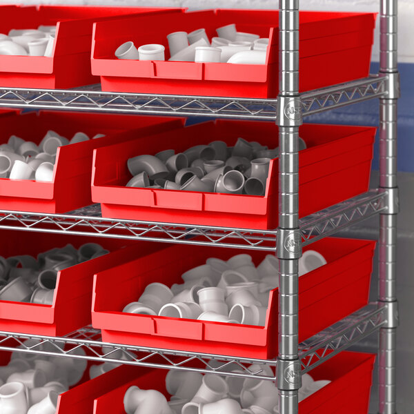 A metal shelving unit with Regency red plastic bins.