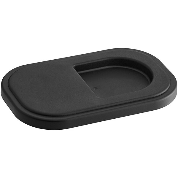 A black plastic rectangular lid with a hole.