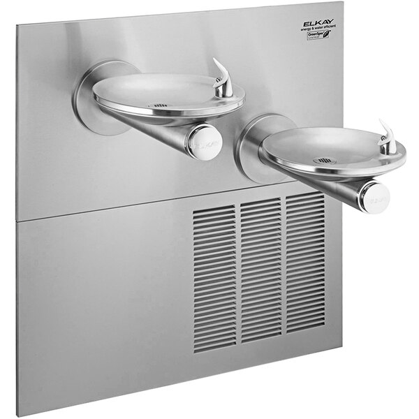 An Elkay stainless steel wall mount drinking fountain with two faucets over a sink.