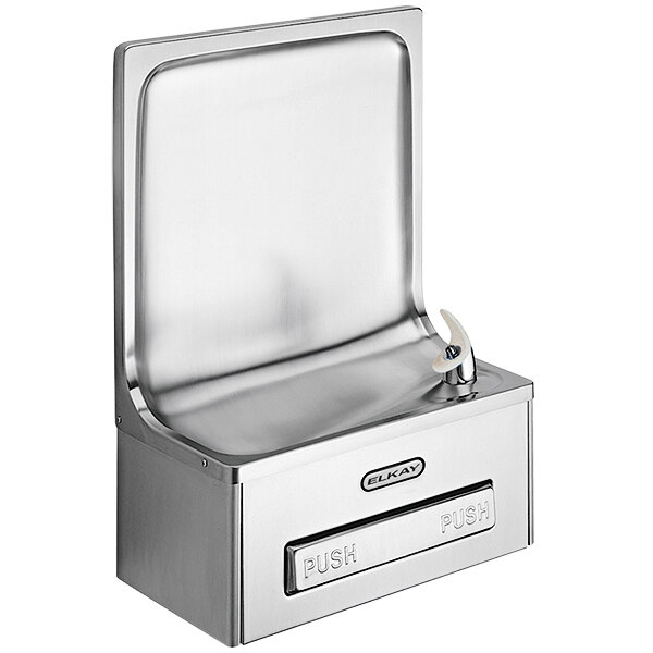 An Elkay stainless steel semi-recessed wall mount non-refrigerated drinking fountain with a push button and a lid.