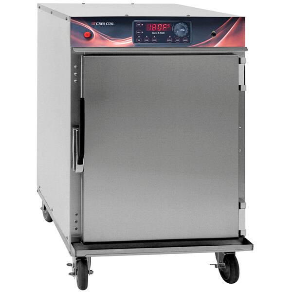 A stainless steel Cres Cor cook and hold oven with a red door and wheels.