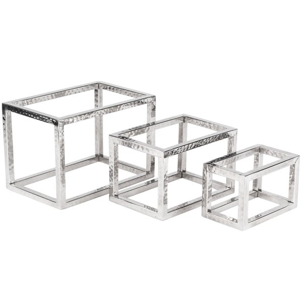 Three silver metal open frame risers with a hammered texture.
