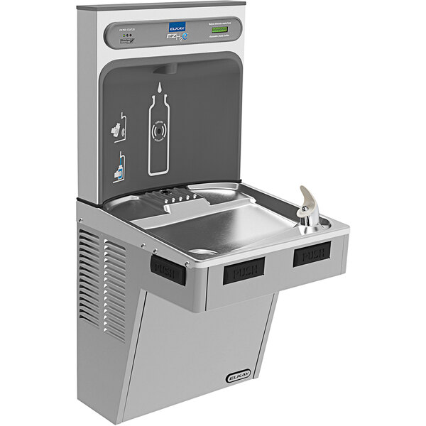 An Elkay light gray hands-free water fountain and bottle filler on a counter in a school kitchen.