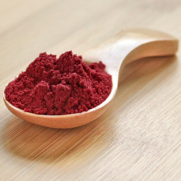 A spoonful of organic red raspberry powder.