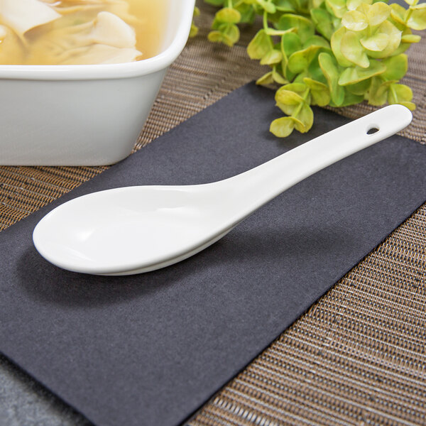 Acopa 0.6 oz. Bright White Ceramic Chinese Soup Spoon / Asian Wonton Soup Spoon - 12/Pack