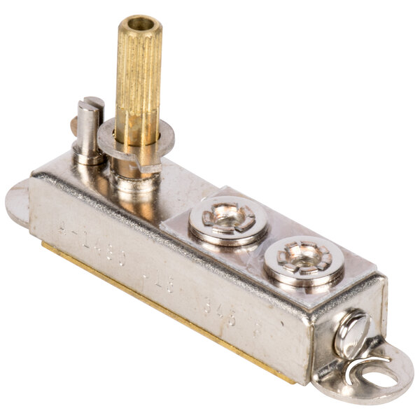 A metal thermostat with two brass screws.