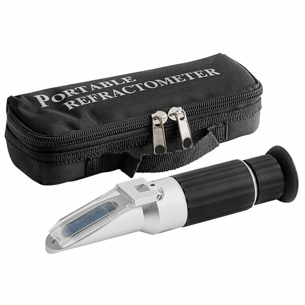 A Vollrath portable refractometer in a black case.