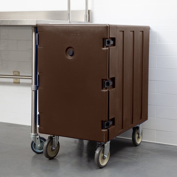 A brown plastic container on wheels.