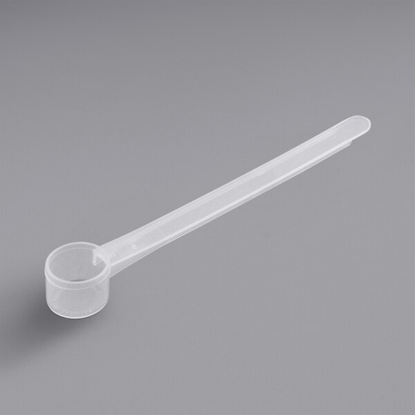 A polypropylene measuring spoon with a long handle.