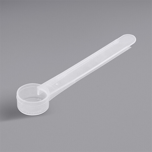 A 3 cc polypropylene measuring spoon with a long handle.