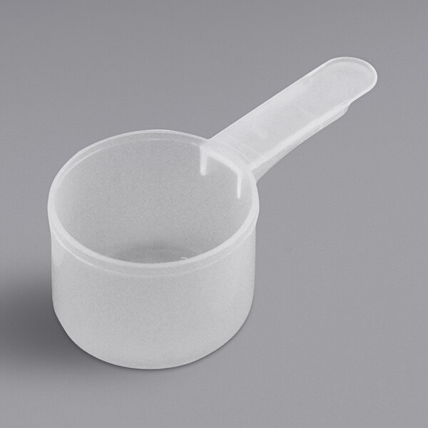 A white plastic measuring cup with a medium handle.