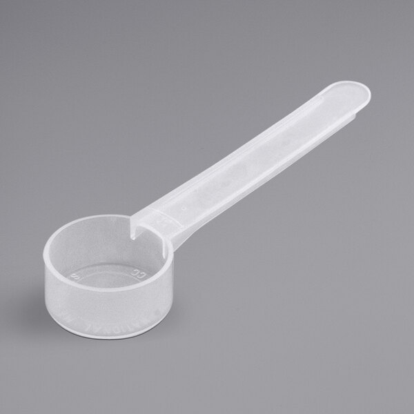 A white plastic spoon with a long handle.