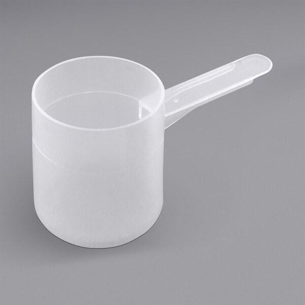 A white plastic measuring cup with a handle.