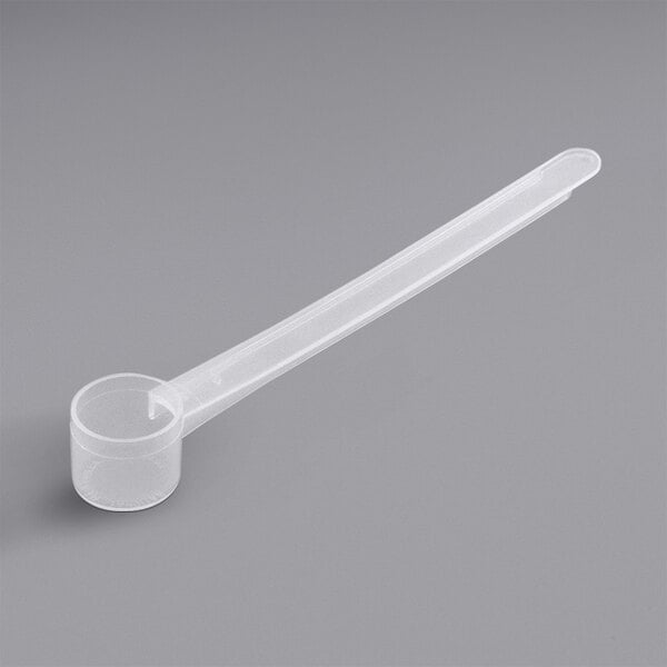 A polypropylene measuring spoon with a long handle.