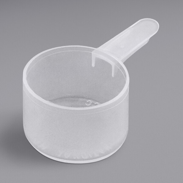 A clear plastic scoop with a short handle.