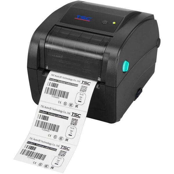 A black TSC label printer printing a white label with barcodes.