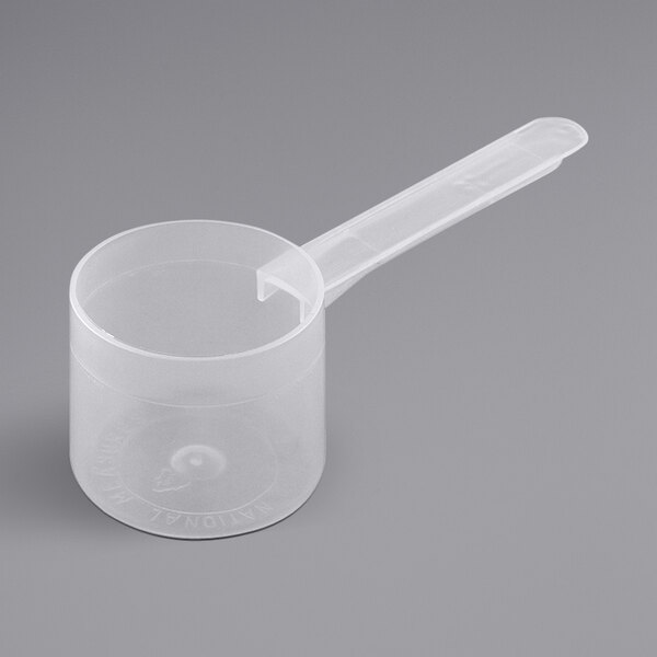 A white plastic scoop with a long handle.