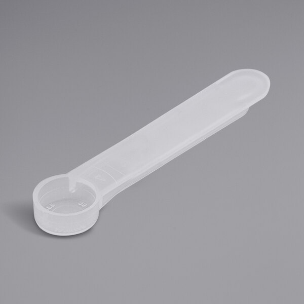 A plastic measuring spoon with a medium handle.