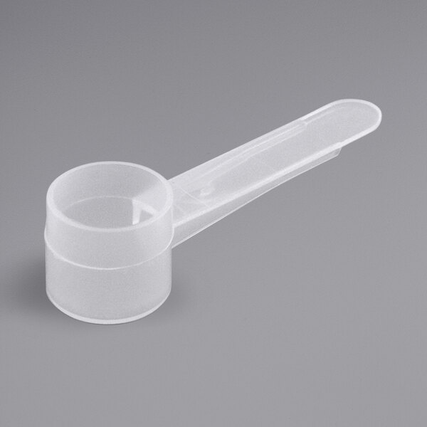 A plastic measuring spoon with a medium plastic handle.