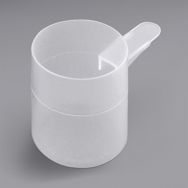 A white plastic measuring cup with a curved handle.