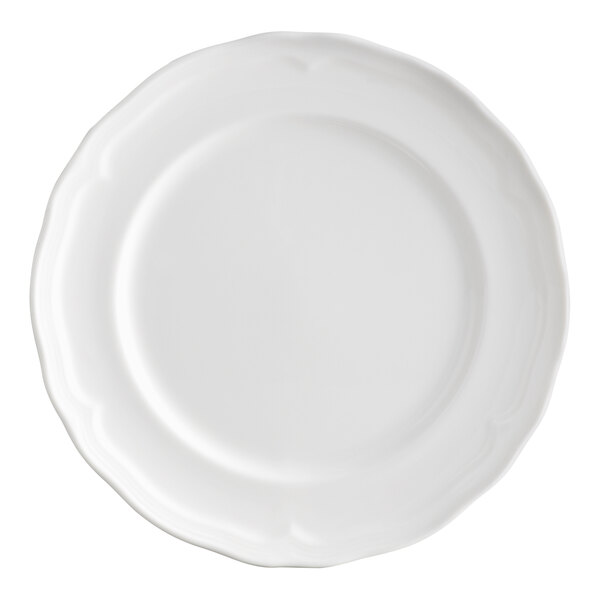A white porcelain plate with a scalloped wide rim.