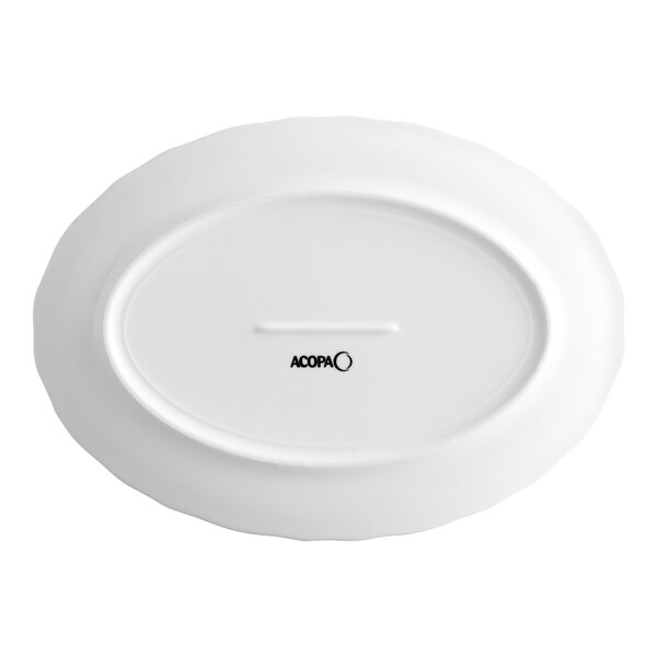 An oval-shaped, white porcelain platter with a scalloped wide rim, shown from the bottom with the Acopa brand logo.