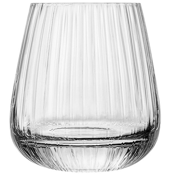 A clear Luigi Bormioli cocktail glass with a wavy design on the bottom.