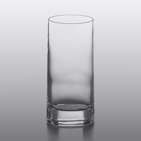 A Luigi Bormioli highball glass on a table.
