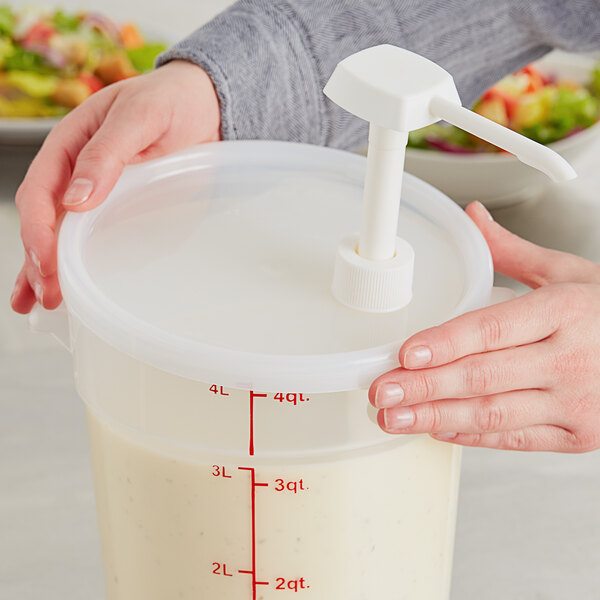 A person using a white Choice pump to pour liquid into a container.