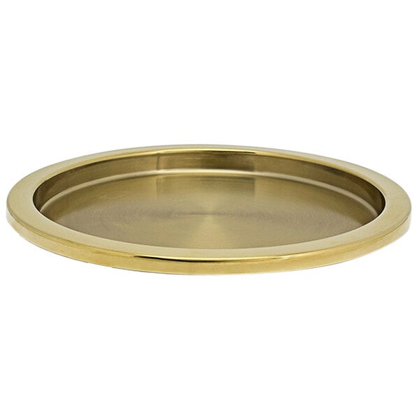 A Room360 round stainless steel tray with a matte brass finish and a round rim.