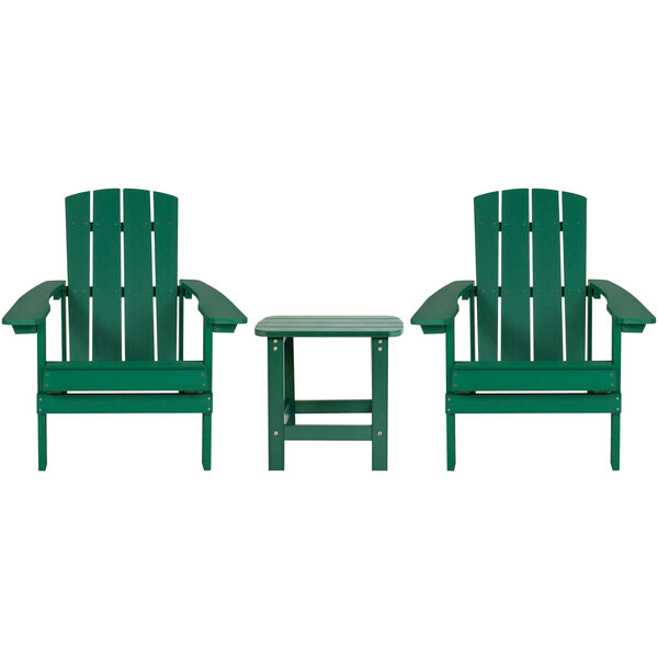 Two green Flash Furniture Adirondack chairs with a small table.